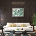 Abstract acrylic painting titled Blushing Ferns by Rebecca Jayne, featuring green and blush pink tones on canvas, framed in oak, set in a living room.