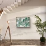 Abstract acrylic painting titled Blushing Ferns by Rebecca Jayne, featuring green and blush pink tones on canvas, framed in oak, set in a hallway.